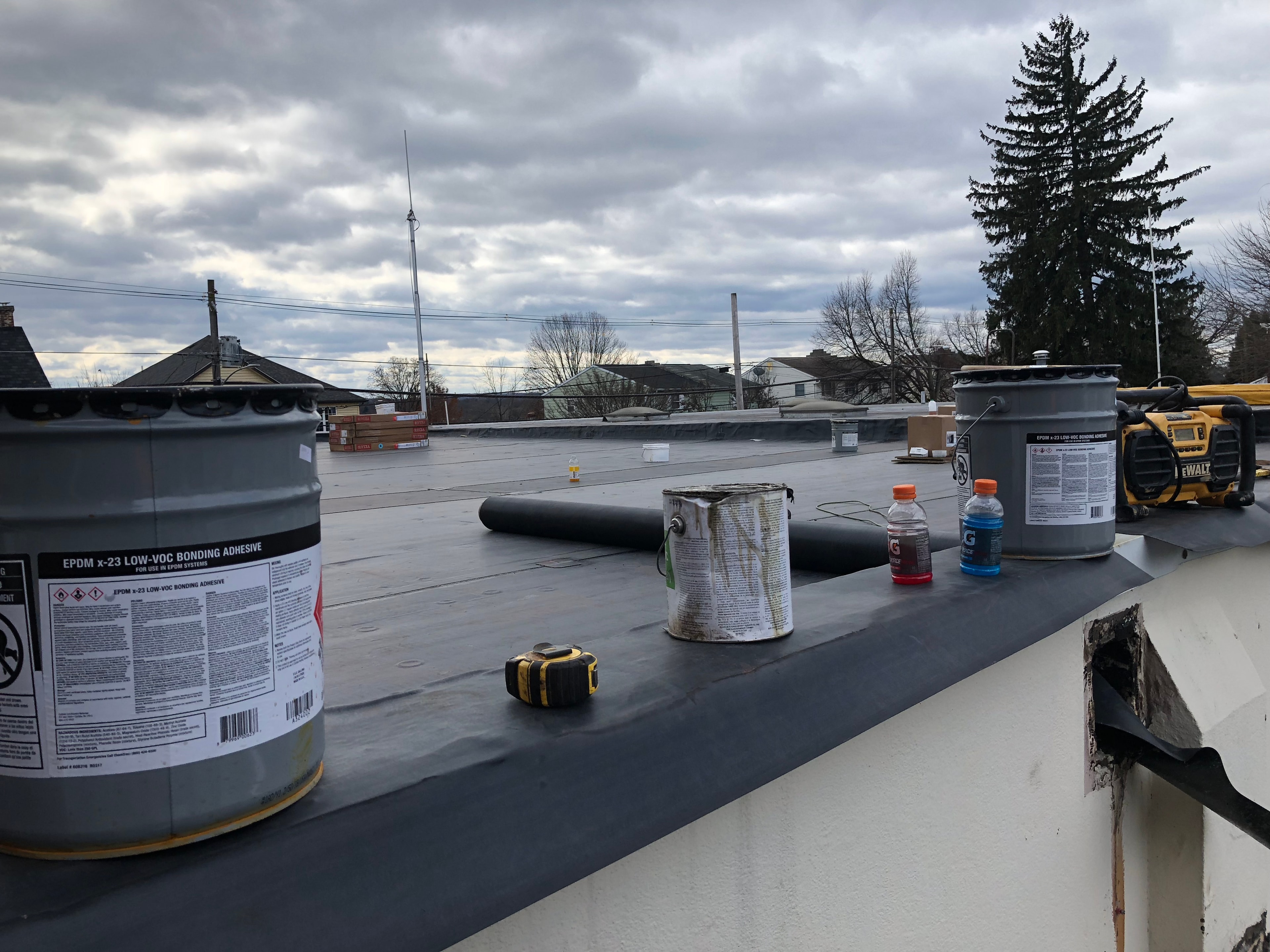 EPDM rubber roofing installation on a flat commercial roof